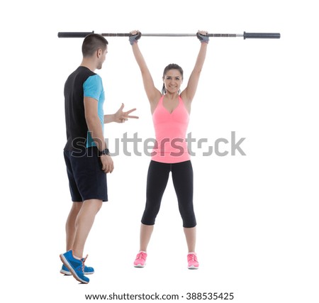 Fitness woman doing exercises with olympic barbell.