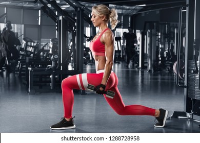 Fitness Woman Doing Lunges Exercises For Leg Muscle Workout In Gym. Active Girl Doing Front Forward One Leg Step Lunge