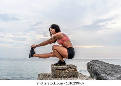 Fitness Woman Doing Pistol Squat Outdoors.