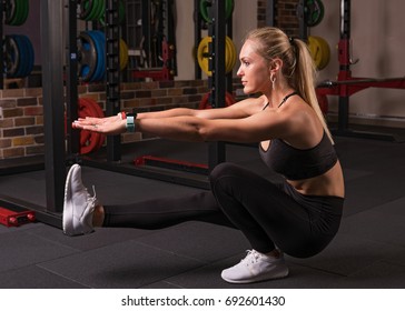 Fitness Woman Doing Pistol Squat In The Gym