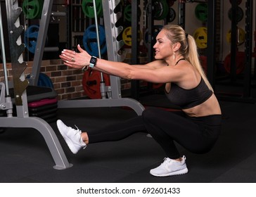 Fitness Woman Doing Pistol Squat Exercise In The Gym