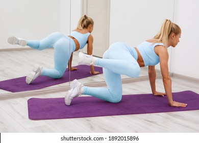 Fitness Woman Doing Side Kick Exercise For Buttocks. Athletic Girl Working Out