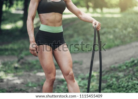 Similar – Fit muscular woman working out in a park