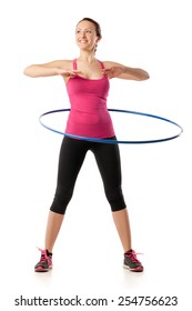 Fitness Woman Dressed In Pink Top And Black Leggins Working With Hula Hoop Smiling Isolated Over White