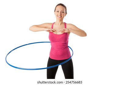 Fitness Woman Dressed In Pink Top And Black Leggins Working With Hula Hoop Smiling Isolated Over White. Half Lngth View