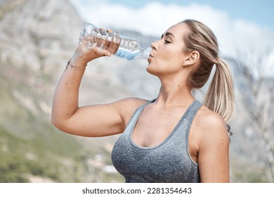 Fitness, woman and drinking water for hydration, workout or recovery break from running exercise in nature. Thirsty active female having natural drink to stay hydrated after intense cardio training