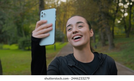 Fitness woman fit athletic sport girl blogger influencer selfie photo on mobile phone in city record workout blog for social media happy smiling Caucasian sportswoman exercise outside drink water rest - Powered by Shutterstock