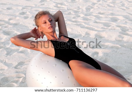 Similar – Young, slender, long-legged woman on a Baltic beach in a summer dress