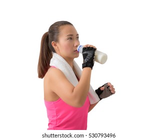 Fitness Woman Happy Smiling Holding Milk Bottle And Drinking Milk. Healthy Lifestyle Photo Of Asian Fitness Model Isolated On White Background.