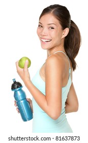 Fitness Woman Happy Smiling Holding Apple And Water Bottle. Healthy Lifestyle Photo Of Asian Caucasian Fitness Model Isolated On White Background.