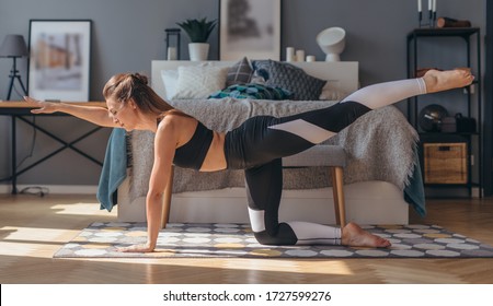 Fitness Woman Practising Yoga Doing Bird Dog Exercise.