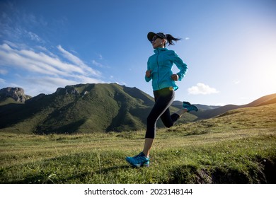 Fitness Woman Runner Running At Mountain Top