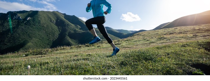 Fitness Woman Runner Running At Mountain Top