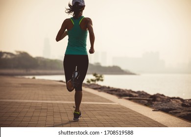 Fitness Woman Runner Running On Sunny Coast Trail