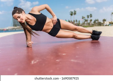 Fitness Woman Strength Training Her Body Core Muscles With Yoga Pose.