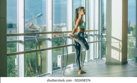 Fitness Woman Stretching In The Gym. Barre