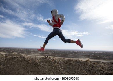 Fitness woman trail runner cross country running  on sand desert dunes - Shutterstock ID 1809698380