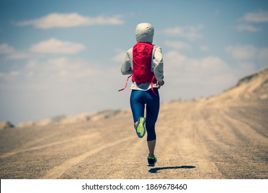 Fitness Woman Trail Runner Cross Country Running On Sand Desert