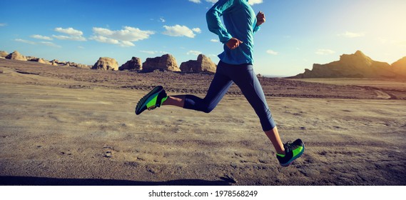 Fitness Woman Trail Runner Cross Country Running On Sand Desert