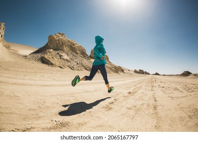 Fitness Woman Trail Runner Cross Country Running  On Desert