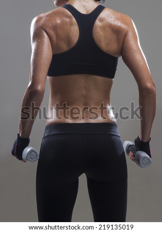 Similar – Rear view portrait of one young middle age athletic woman at crossfit training, exercising with trx suspension fitness straps over dark background