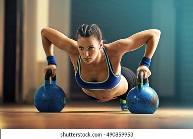 Fitness Woman Training By Kettlebell.