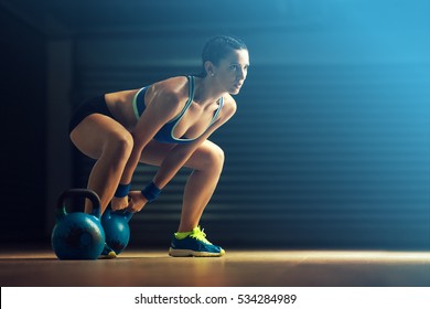 Fitness Woman Training By Kettlebell.