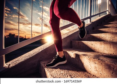 Fitness woman training and jogging in city,close up on sport shoes. Sport and healthy lifestyle concept.