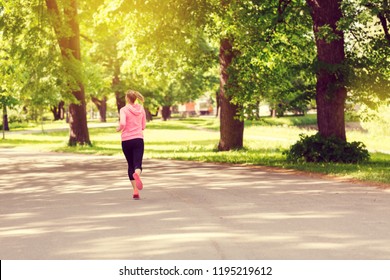 Fitness woman training and jogging in summer park,. Healthy lifestyle and sport concept - Shutterstock ID 1195219612