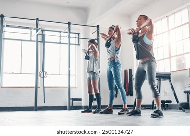 Fitness, women and group with kettlebell for weight training, wellness and body workout. Team, cardio and personal trainer challenge with active routine for health exercise at class in gym center