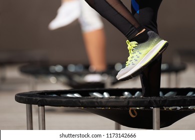 Fitness women jumping on small trampolines,exercise on rebounder - Shutterstock ID 1173142666