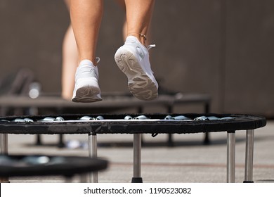 Fitness women jumping on small trampolines,exercise on rebounder