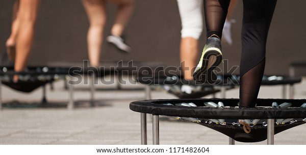 Fitness women jumping on small
trampolines,exercise on
rebounder