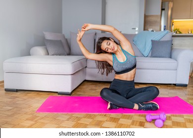 Fitness Workout, Yoga Exercise For Woman. Beautiful Girl With Fit Slim Body Doing Stretching In Morning. Sporty Female Model Exercising, Practicing Yoga At Home. Healthy Lifestyle And Wellness Concept