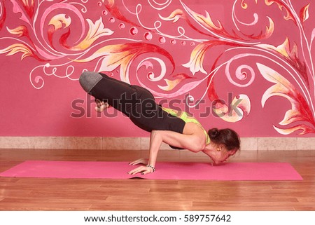 Fitness or yoga class, sport woman doing exercise in gym.