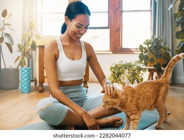 Fitness, yoga or happy woman bonding with cat or pet animal relaxing for wellness or healthy lifestyle. Smile, calm or zen girl loves caring, quality time or playing with kitten or kitty at home - Powered by Shutterstock
