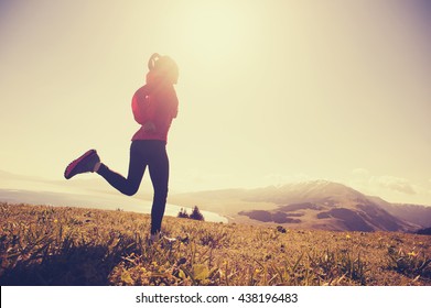 Fitness Young Woman Trail Runner Running On Beautiful Mountain Peak