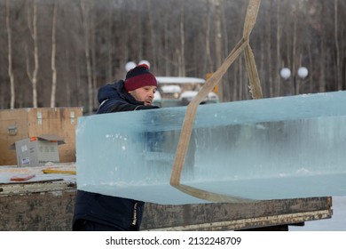 Fitter In A Blue Hooded Jacket At An Ice Slab Installation