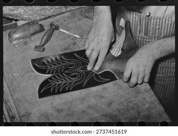 Fitting upper to lower part of boot. Bootmaking shop, Alpine, Texas by Russell Lee. Vintage photography by Russell Lee. Vintage America in photo by Russell Lee.