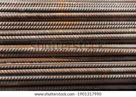Fittings for construction. Shot of steel rods or bars used to reinforce concrete for construction. Stack of construction armature. Element of the constructional structure. Rusty fittings