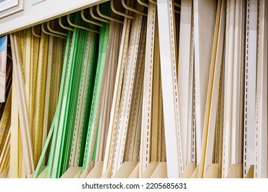 Fittings For Home Decoration And Exterior Facade Panels On Racks In A Hardware Store Sale. Materials For Repair And Construction.