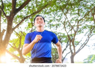 Fittness Young Man Jogging In The City Park