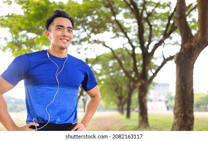 Fittness Young Man Jogging In The City Park