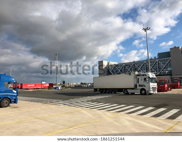 fiumicino\
airport cargo city heavy trailer are parked  to pick cargo luggage\
photo date 25-11-2020 fiumicino rome\
italy