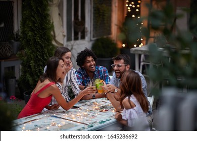 Five Adults Making Toast With Cocktails, At The Outdoor Bar, Laughing, Having Fun. Fun, Party, Socializing, Multiethnic, Introvert And Extrovert Persons Concept