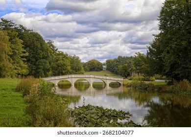 The Five Arch Bridge and Gothic Tower at Painshill Park in Cobham Surrey UK