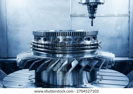Five axis arm CNC machine Producing precision turbine wheel part.