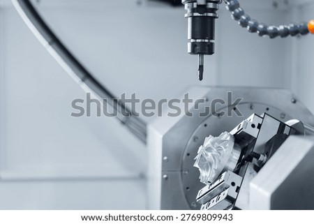 Five axis CNC machining center cutting engine turbine. Concept modern technology for industry.