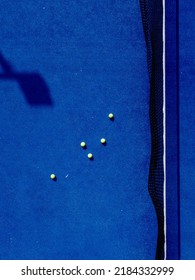 Five Balls On A Blue Paddle Tennis Court Aerial View