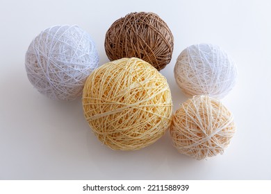 Five Balls Of Yarn Of Different Sizes Isolated On White Background